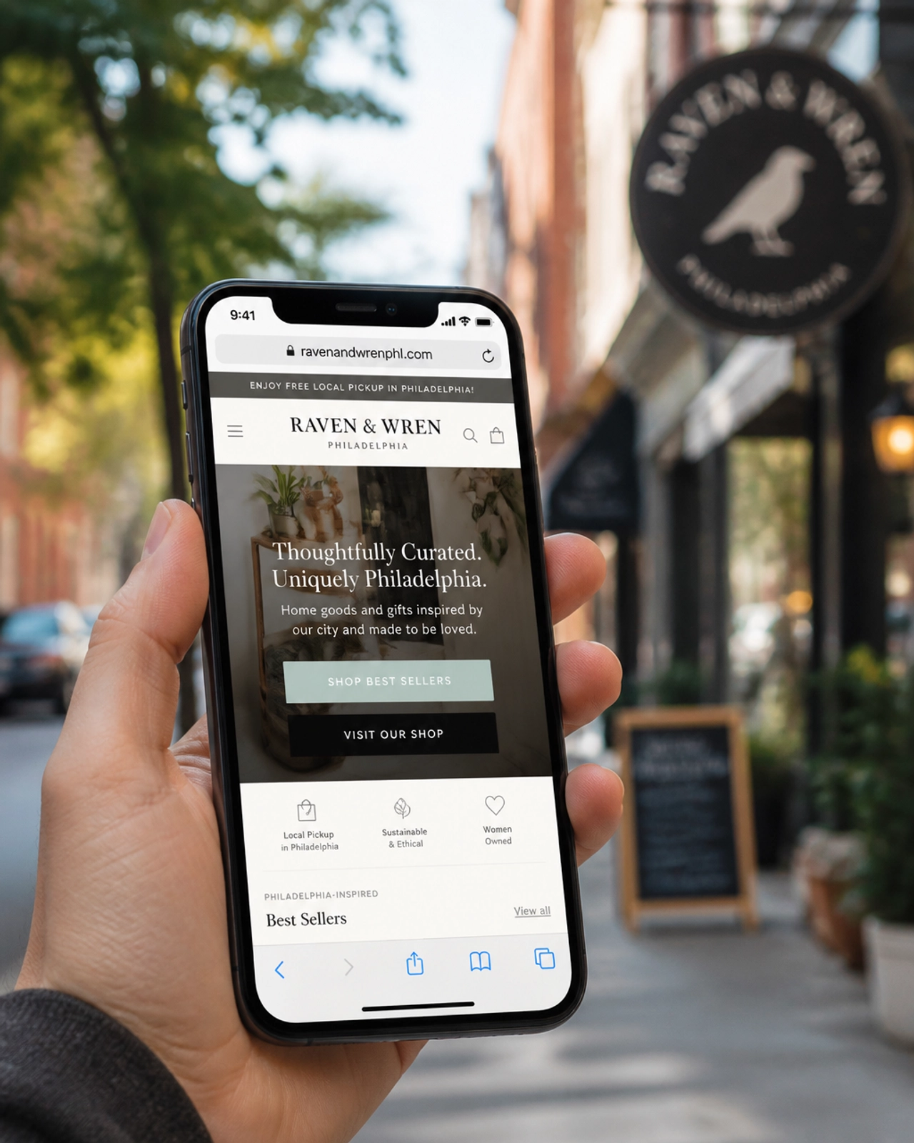 A high-end smartphone showing a fast-loading, ADA-compliant website for a local Philly business.