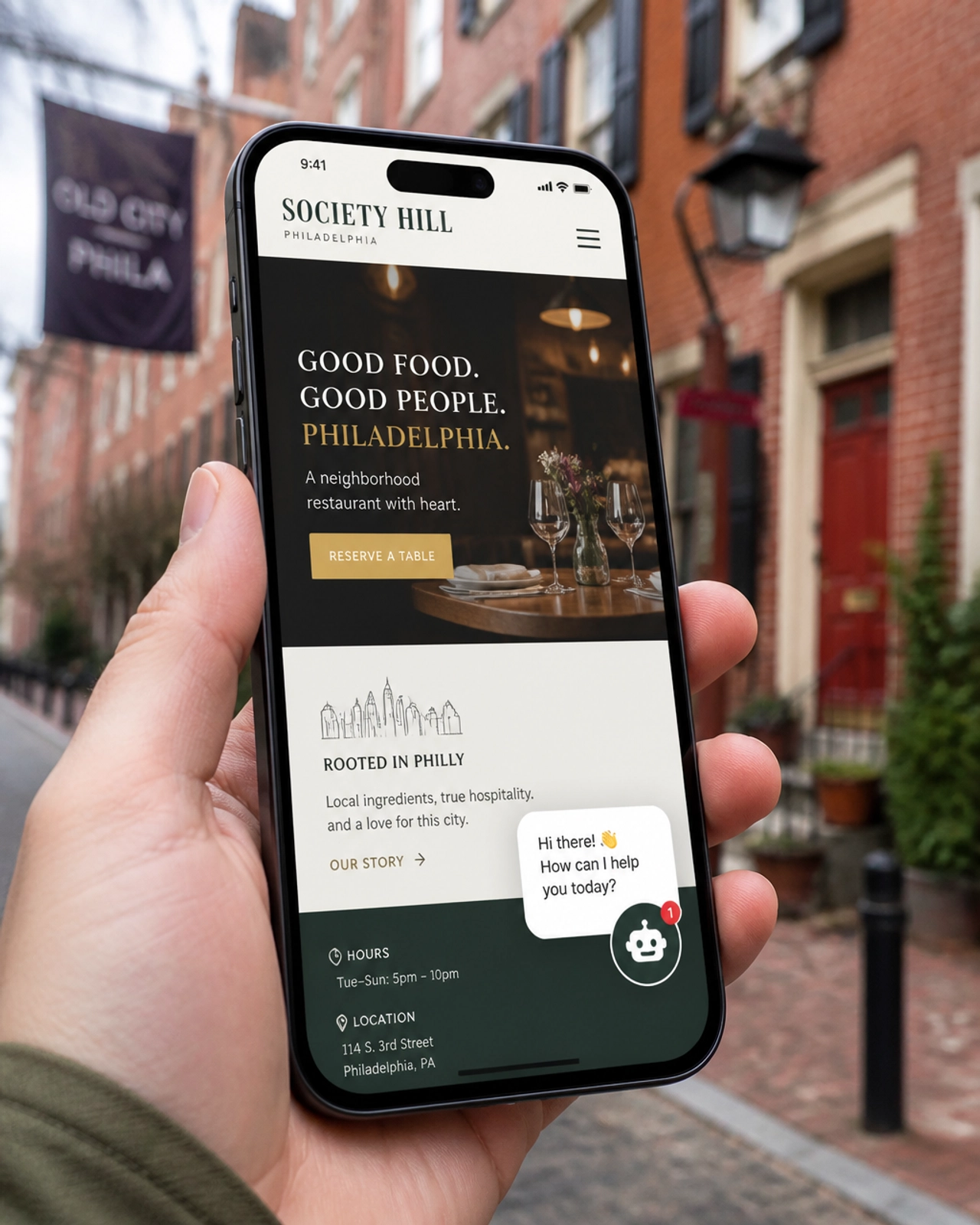 Mobile phone showing a Philly business website with an AI chatbot